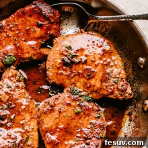 Skillet with pan fried pork chops