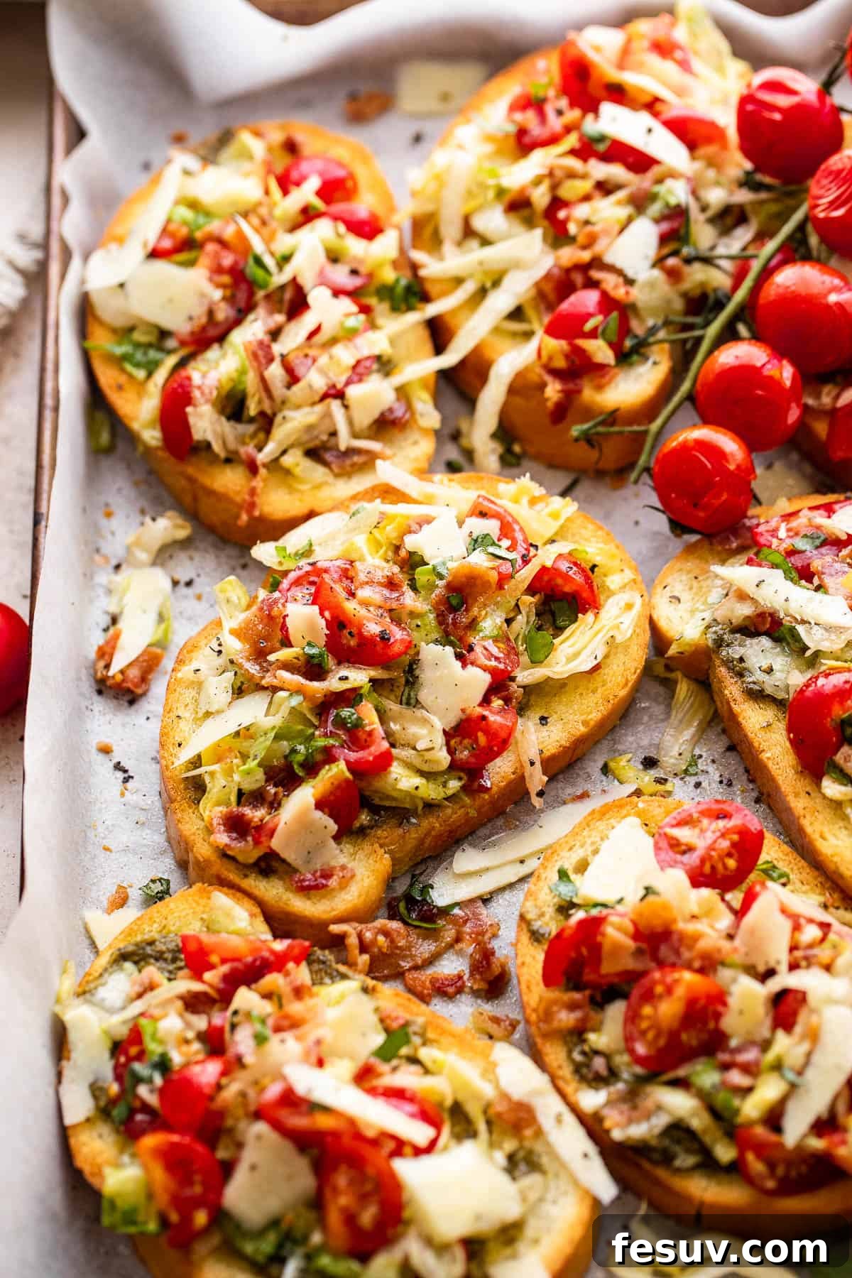 A serving tray laden with beautifully arranged BLT Bruschetta, garnished and ready for guests to enjoy