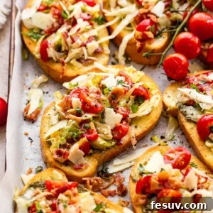 bacon, lettuce, and tomato topped toasted bread slices served on a tray