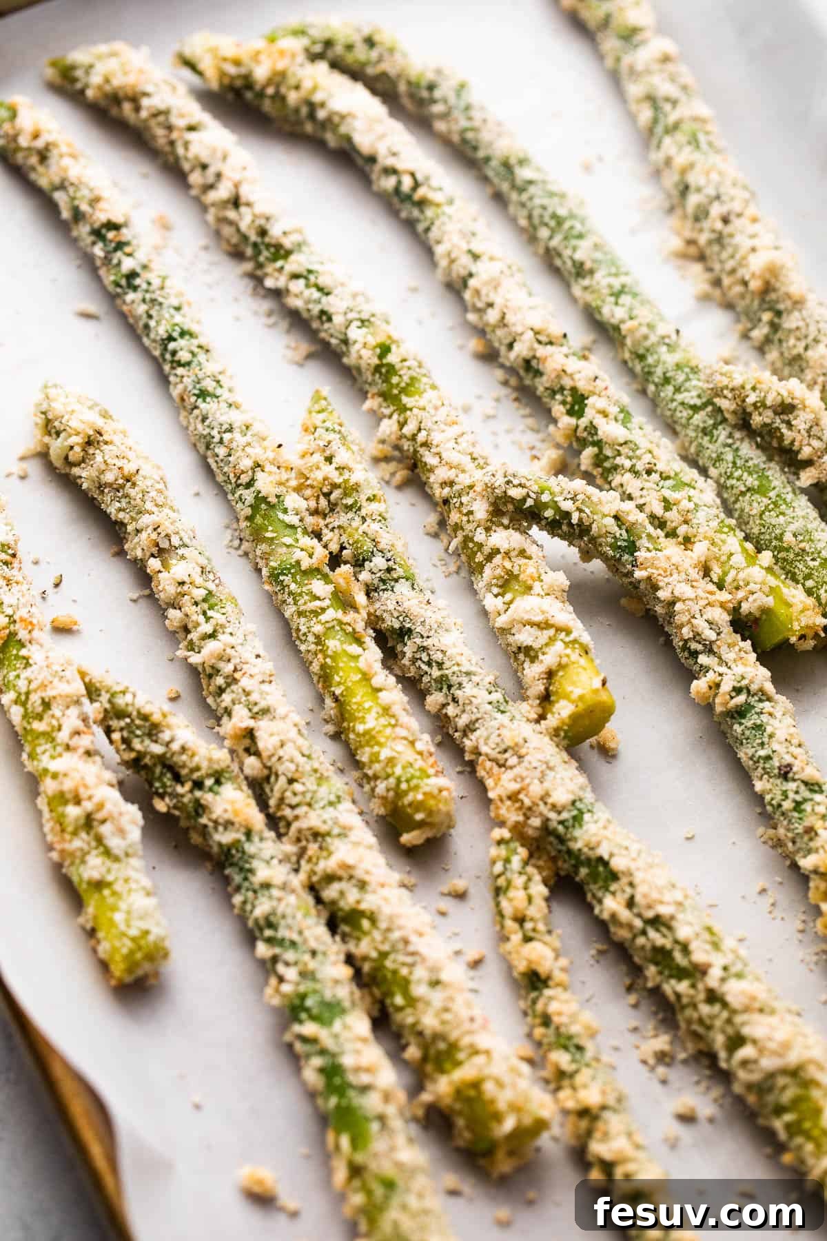 arranged fresh asparagus spears coated with parmesan panko crumbs
