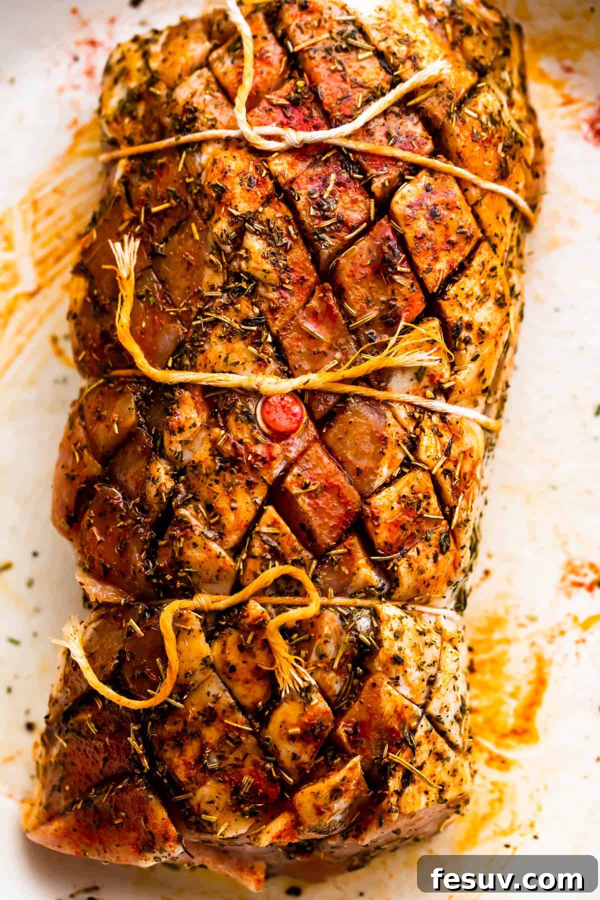 Herb-Crusted Pork Loin with Roasted Root Vegetables 4 raw pork loin roast tied with kitchen twine