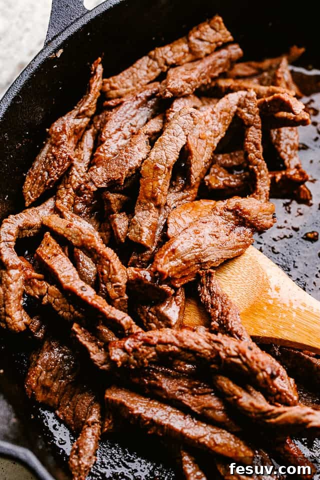 This flank steak with zucchini noodles is the flavorful, summertime dinner you’ve been looking for! Even better, it's ready in 20 minutes! Searing flank steak in a skillet.