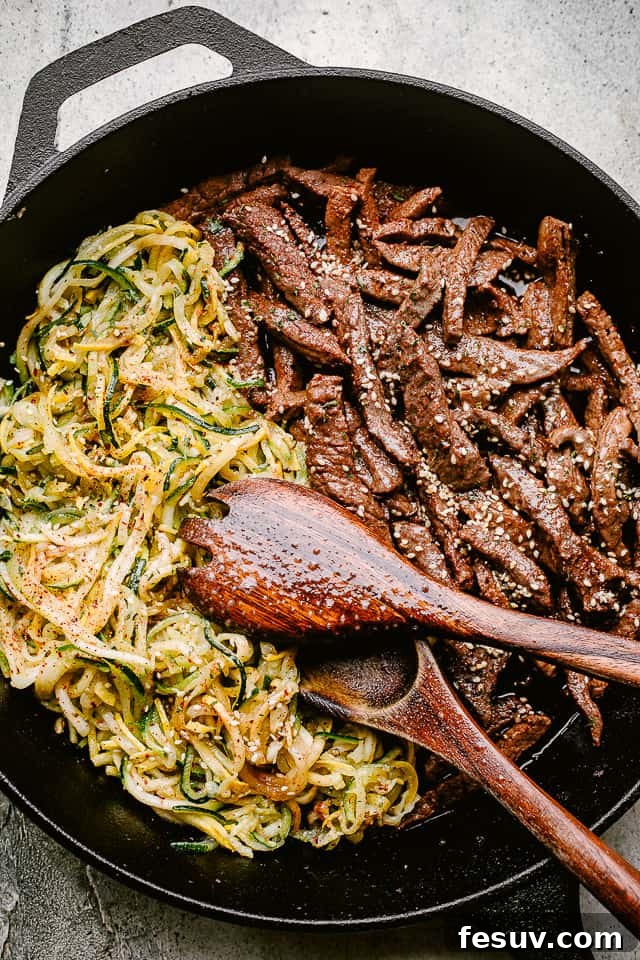 This flank steak with zucchini noodles is the flavorful, summertime dinner you’ve been looking for! Even better, it's ready in 20 minutes! Skillet with flank steak and zoodles
