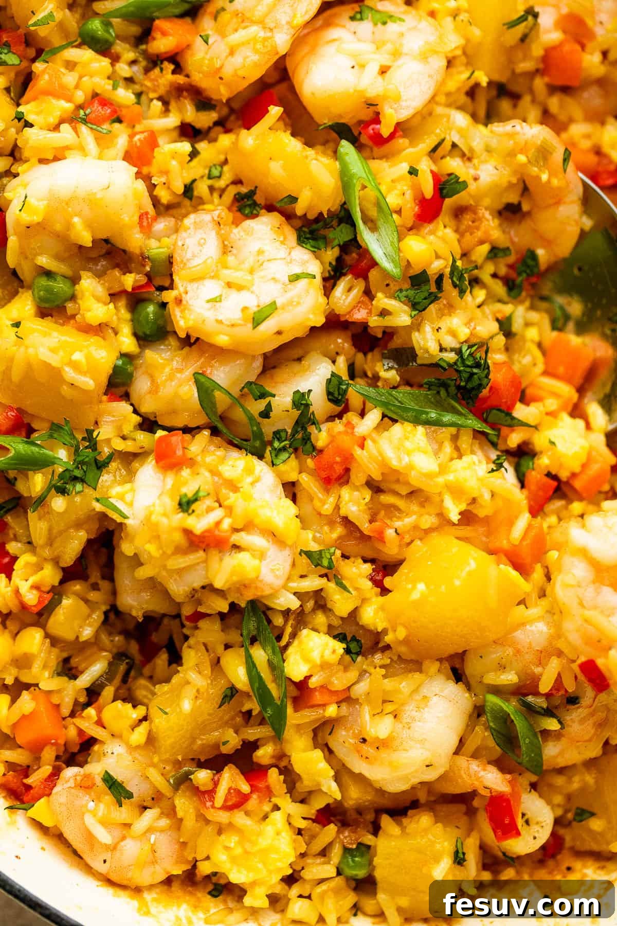Tropical Pineapple Shrimp Fried Rice 7 Close-up shot of the vibrant Easy Shrimp Fried Rice with Pineapple, highlighting the cooked shrimp, rice grains, and pineapple chunks.