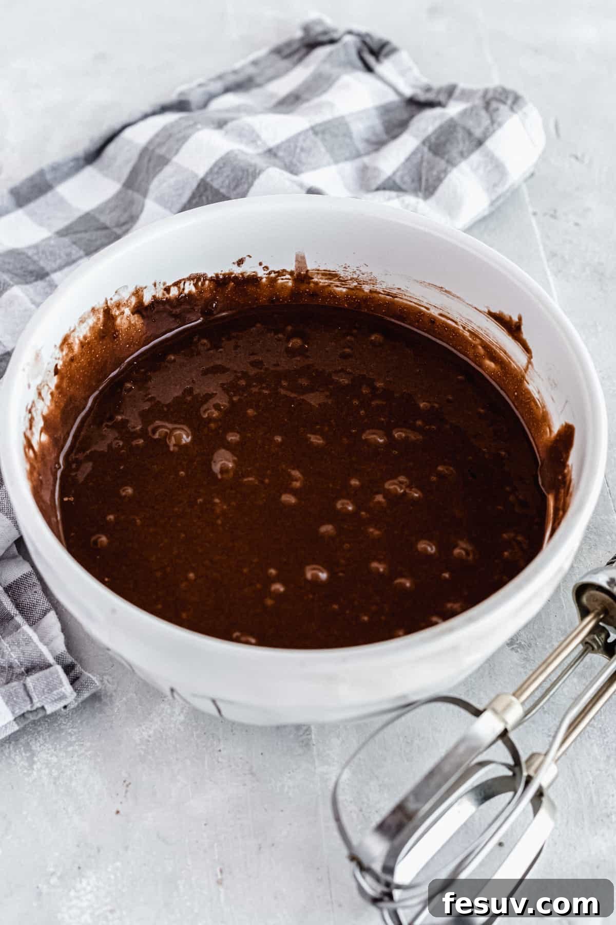 A bowl of chocolate cake batter ready for the oven