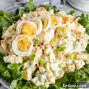 A Big Plate of Salad with Smaller Plates Stacked in the Background