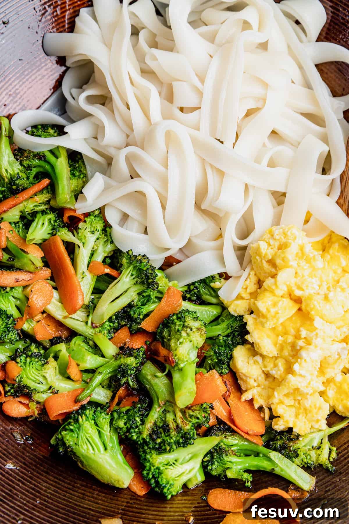 Thai Wide Noodle Perfection 6 A Bowl of Cooked Rice Noodles, Eggs and Vegetables