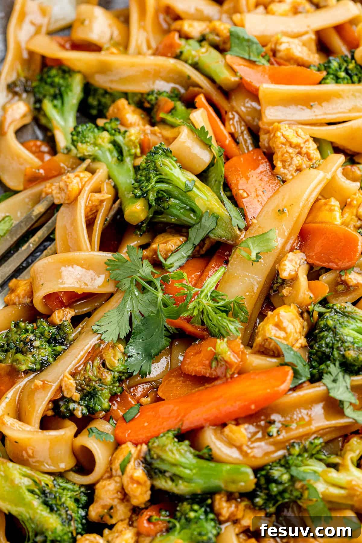 Thai Wide Noodle Perfection 9 A Super Close-Up Shot of Pad See Ew with a Fork Peeking Through in the Corner