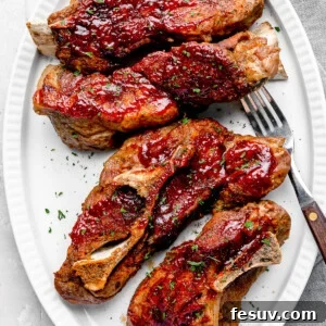 Fall-Off-The-Bone Instant Pot Ribs 8 Four Instant Pot Ribs Garnished with Chopped Parsley on a White Plate