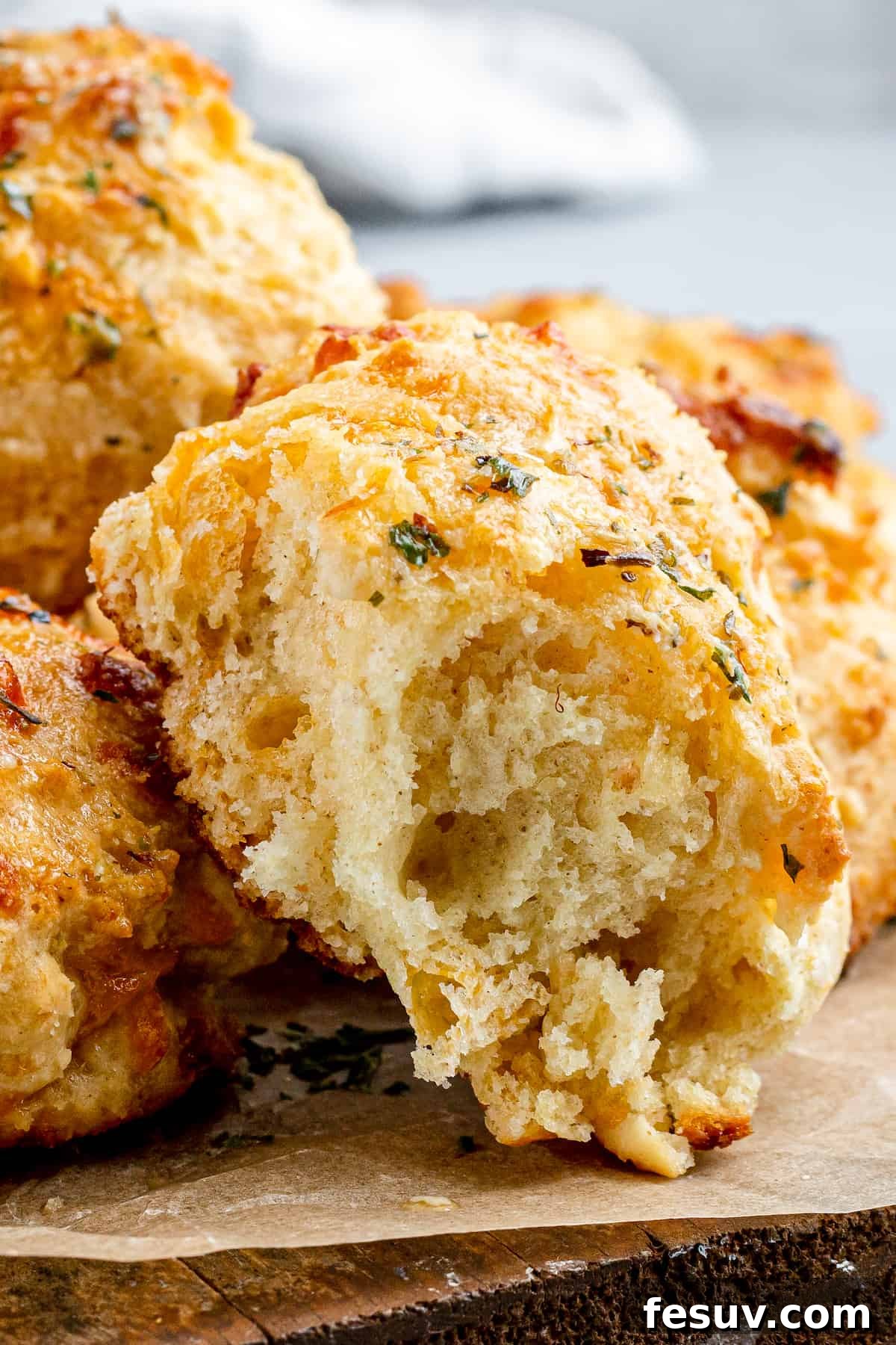 An Air Fryer Red Lobster Biscuit with a Bite Taken Out to Reveal the Fluffy Interior