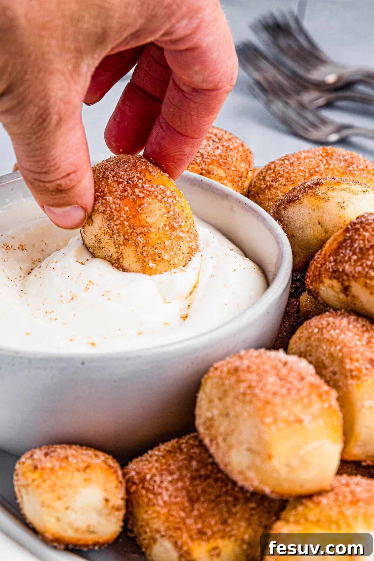 A bowl of luscious cream cheese dip, ready to accompany the pretzel bites.