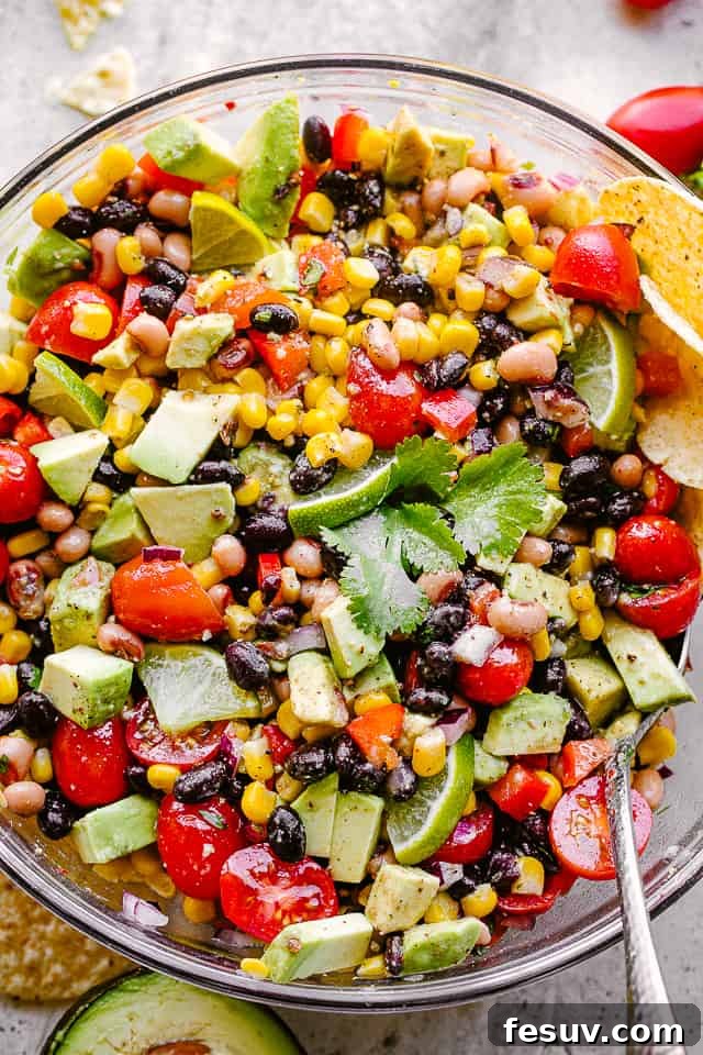 Up close overhead shot of vibrant Cowboy Caviar with tortilla chips