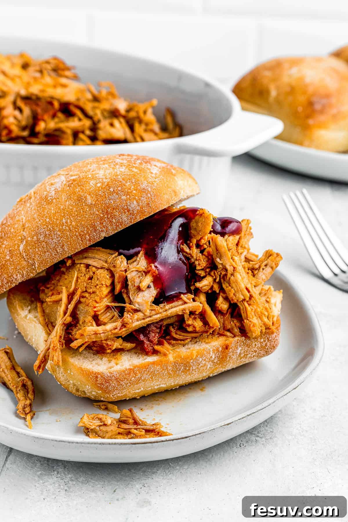 Effortless Instant Pot Pulled Pork with Zesty Coleslaw 7 Empty sandwich buns ready to be filled with juicy pulled pork, sitting on a wooden surface