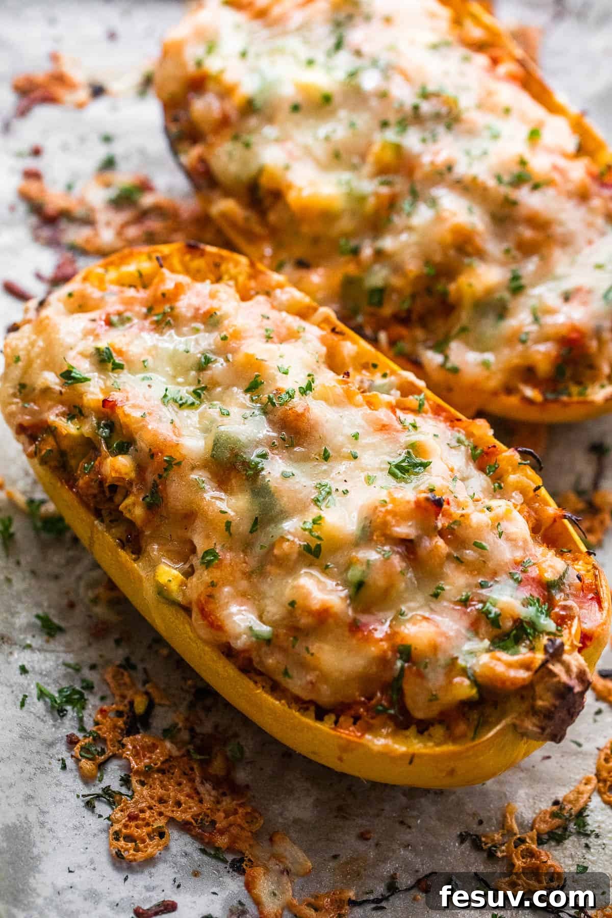 Spaghetti squash stuffed with chicken enchilada filling and topped with melted cheese and fresh cilantro.