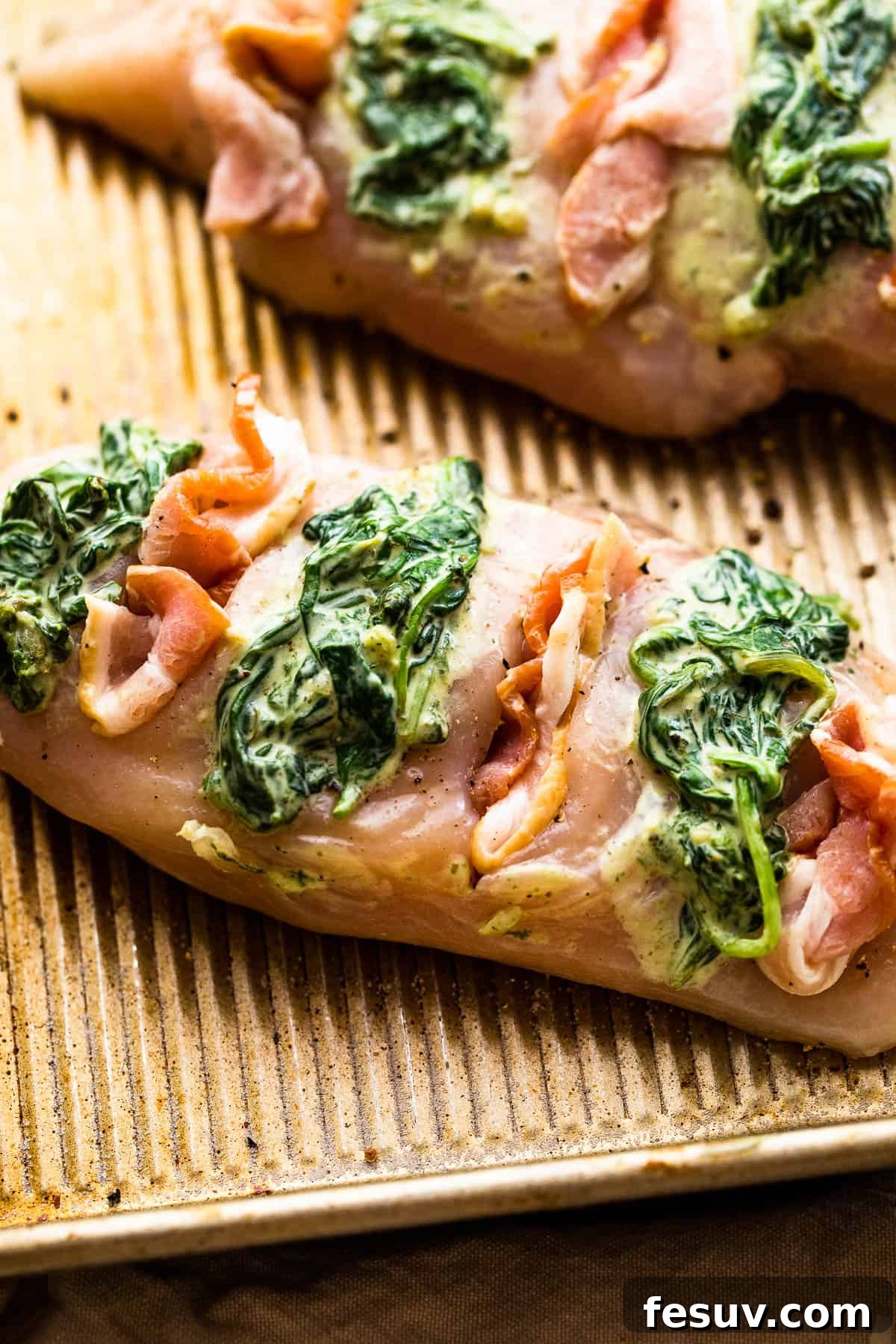 Decadent Cheesy Spinach Bacon Stuffed Chicken 5 raw chicken breasts cut hasselback style and stuffed with creamed spinach plus bacon