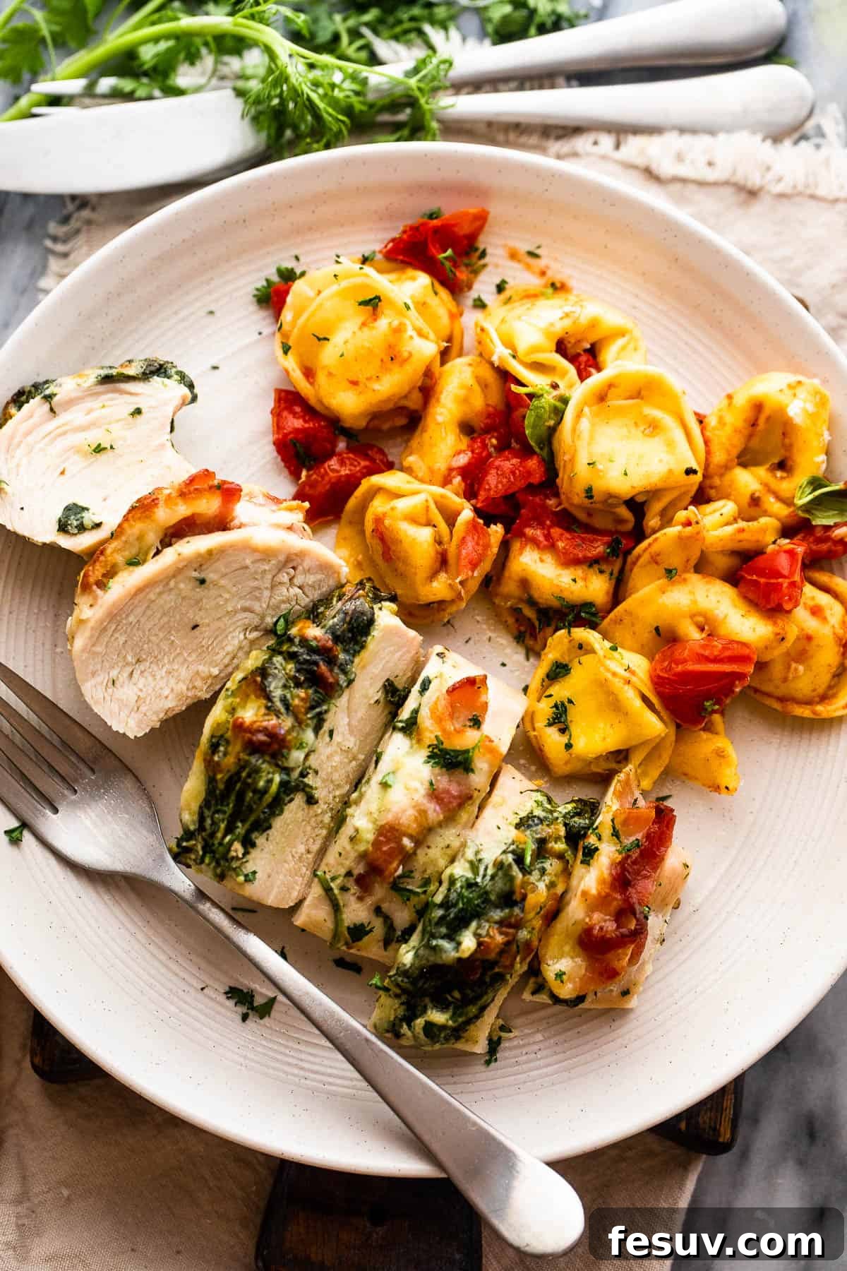 Decadent Cheesy Spinach Bacon Stuffed Chicken 6 cut up stuffed chicken breast served alongside tortellini pasta