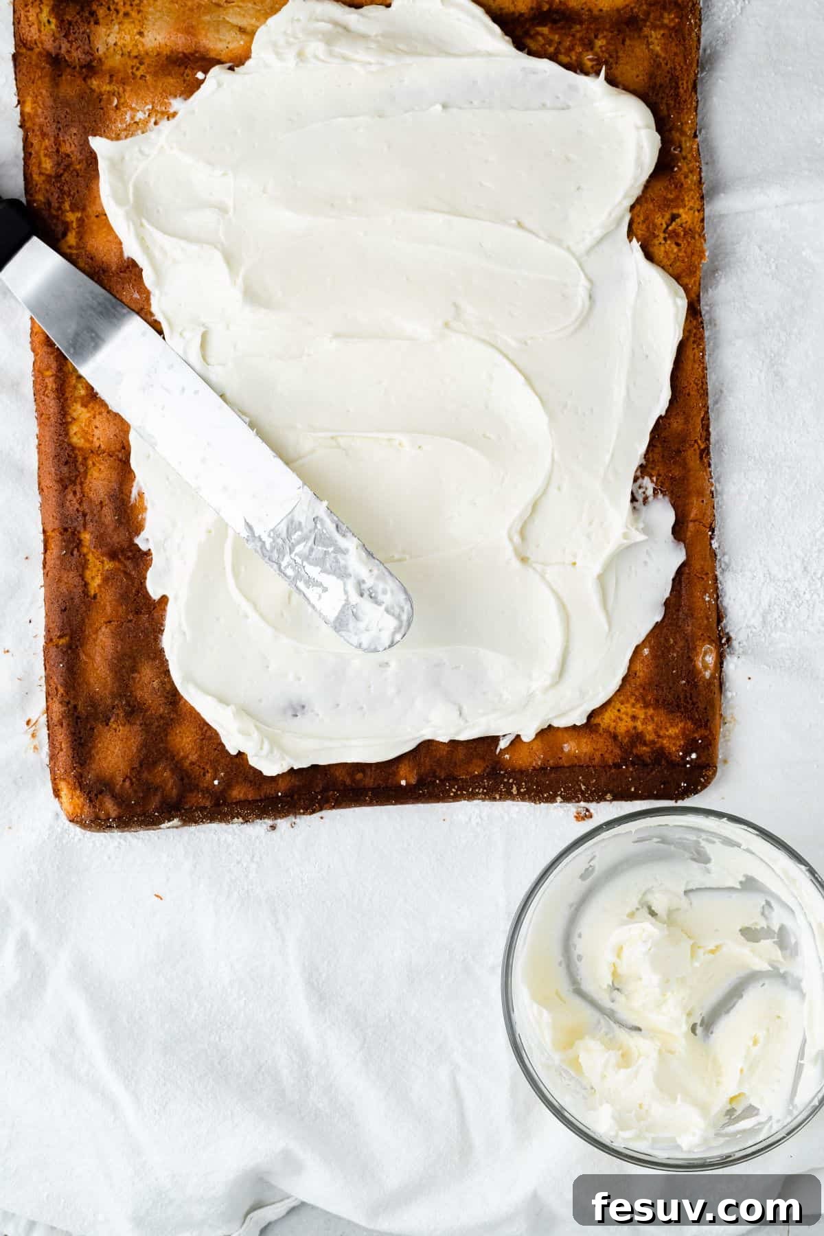 An unrolled pumpkin roll cake spread with filling