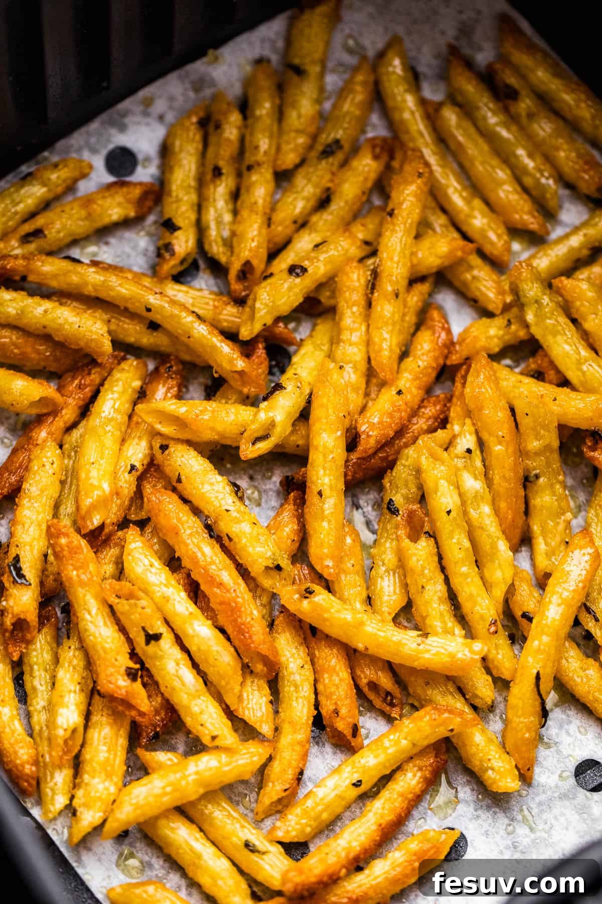 Crispy Pasta Chips Air Fried or Oven Baked 5 baked pasta chips in air fryer basket
