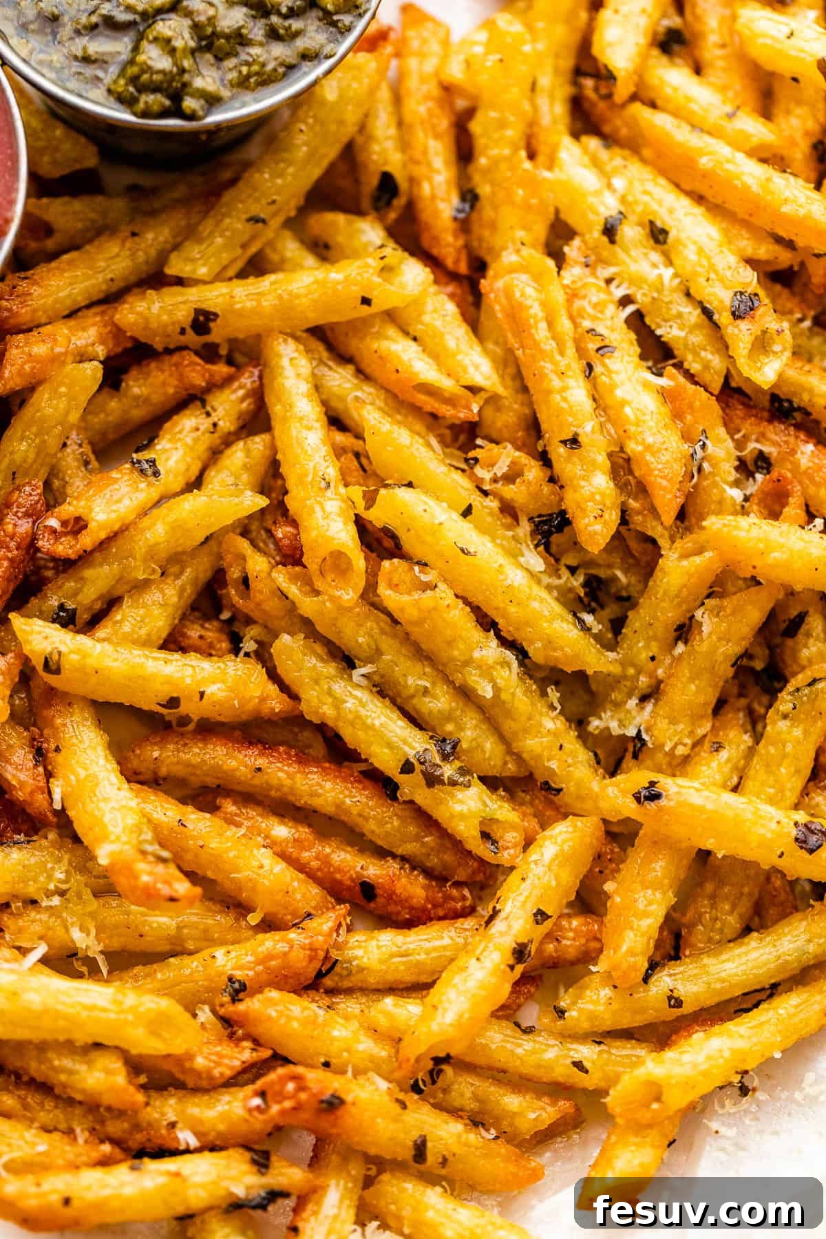 Crispy Pasta Chips Air Fried or Oven Baked 6 close up of baked pasta chips served with basil pesto