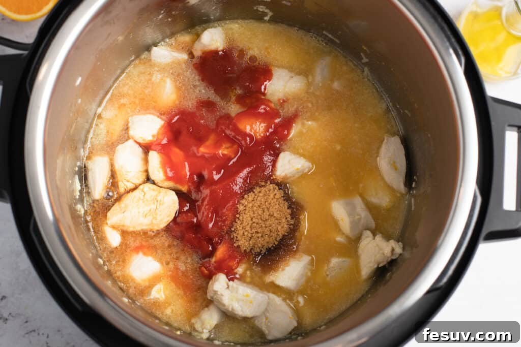 Chicken and various sauce ingredients being added to the Instant Pot before pressure cooking.