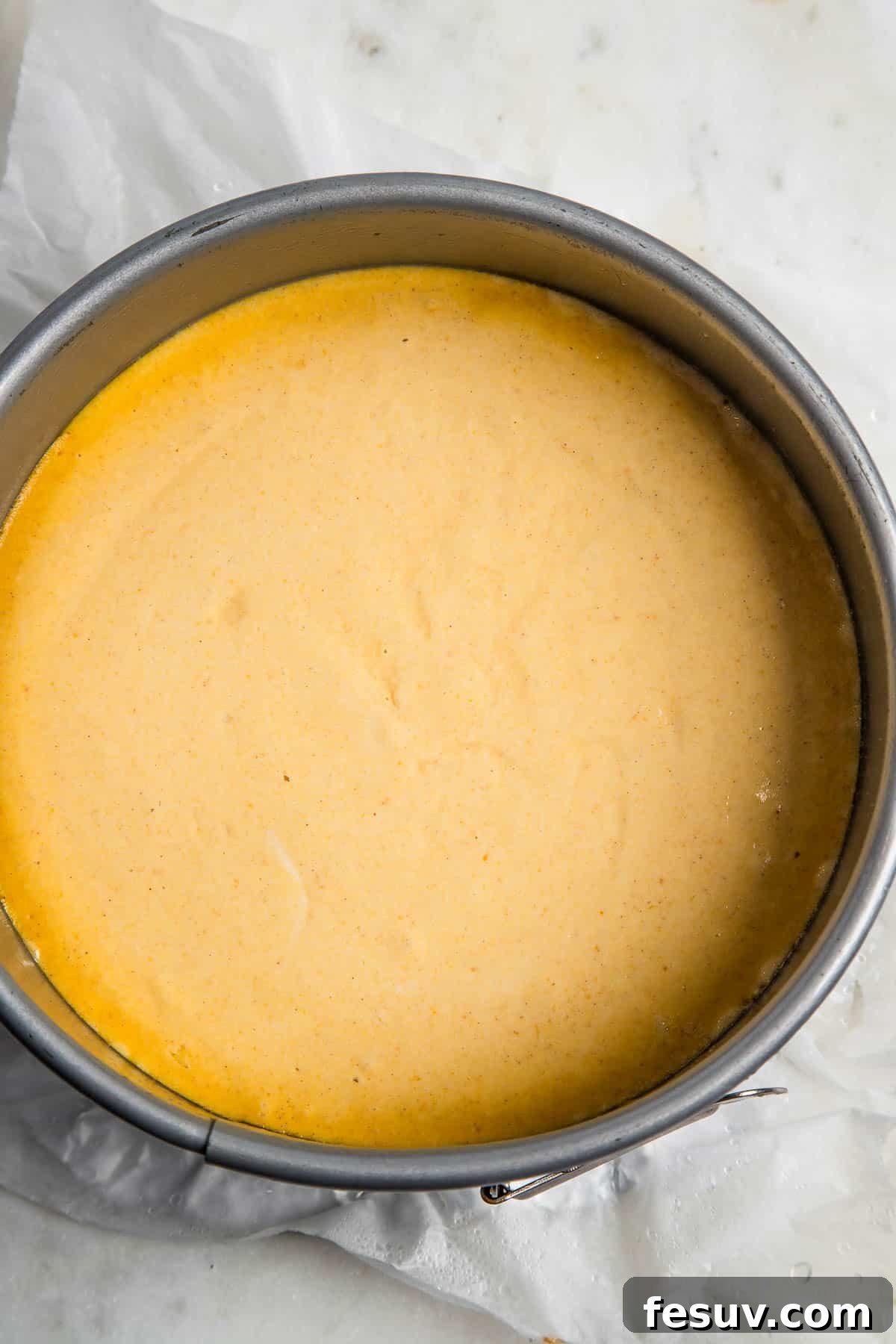 Creamy Instant Pot Pumpkin Cheesecake Bliss 5 A freshly 'baked' pumpkin cheesecake nestled inside the Instant Pot insert, perfectly set and ready for cooling.