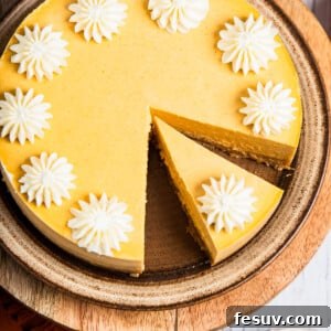 Creamy Instant Pot Pumpkin Cheesecake Bliss 9 Pumpkin cheesecake decorated with whipped cream.