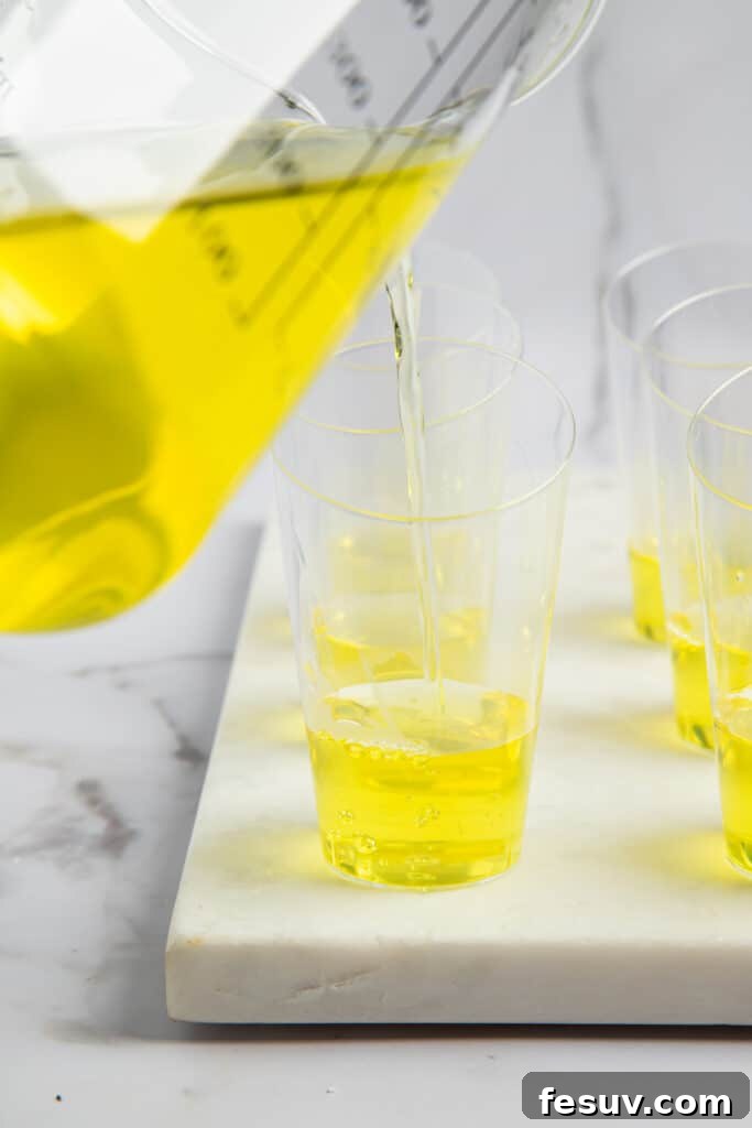 Vibrant Vodka Candy Corn Shooters 4 Lemon jello poured into shot glasses.