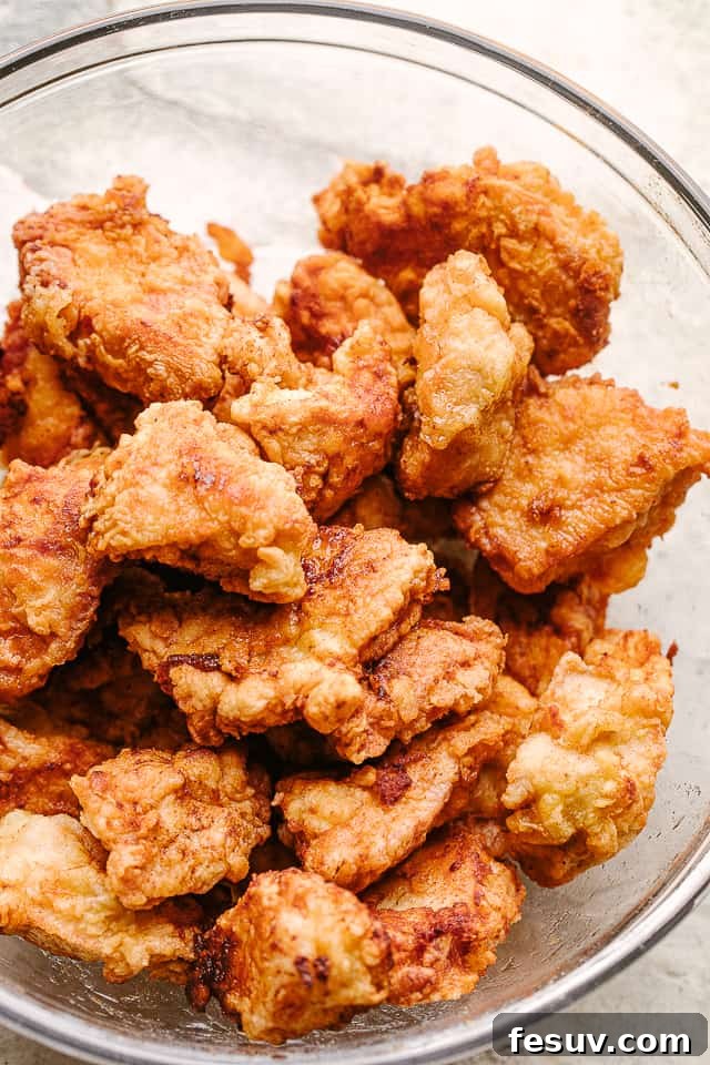Our honey sesame chicken is better than take out! Crispy chicken pieces coated in a sweet and sticky sesame chicken sauce with huge flavor! Chicken bites breaded and fried