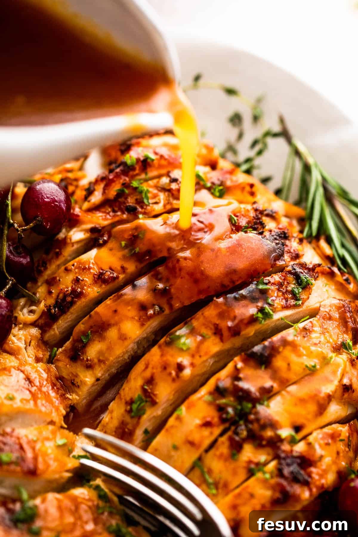 Perfectly Roasted Turkey Breast 4 pouring gravy over sliced turkey breast