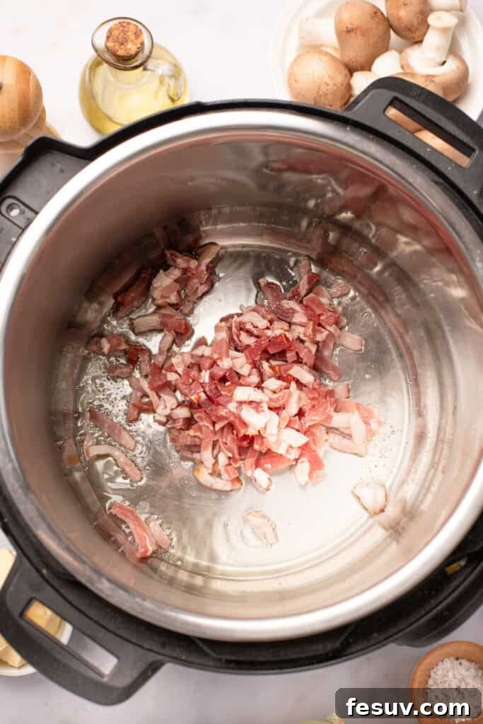 Instant Pot Coq au Vin: Classic French Flavor, Modern Speed 5 Diced bacon frying in an Instant Pot.