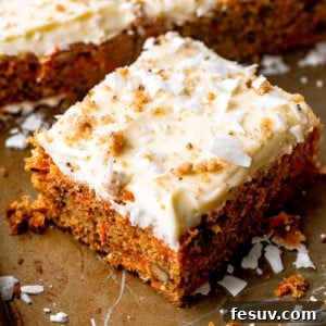 square slice of carrot cake with cream cheese frosting