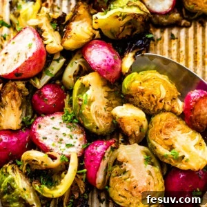 Crispy Roasted Brussels Sprouts and Radishes 7 Close up shot of halved Roasted Brussels Sprouts and Radishes on a baking sheet
